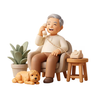 A man laughs while talking on an old-style corded phone in an armchair, with a golden puppy lying at his feet.